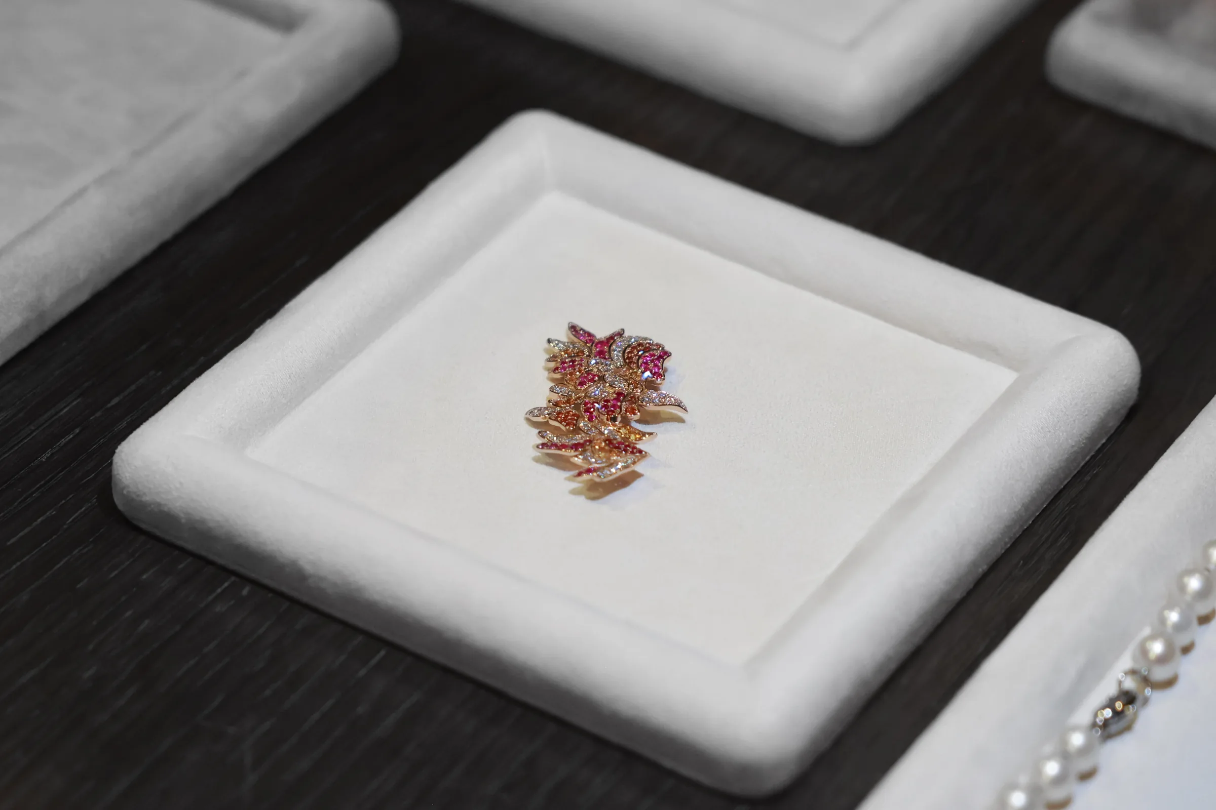 Industrial Garden floral brooch resting in a jewellery case